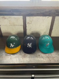 3 baseball helmets