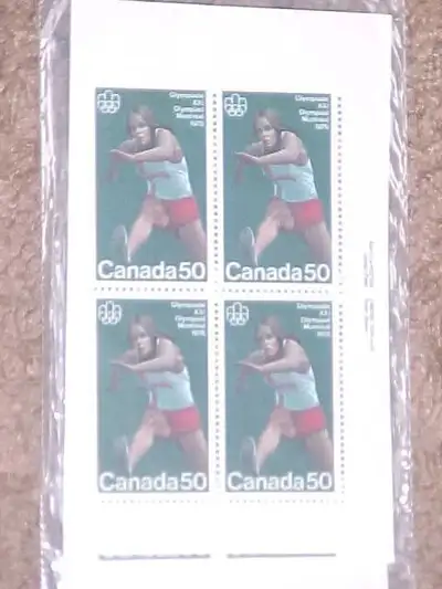 THIS IS AN UNOPENED MATCHED SET OF 4 INSCRIPTION BLOCKS. IT WAS ISSUED FOR THE 1976 MONTREAL OLYMPIC...