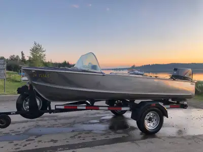 Aluminum fishing boat with bucket seats steering wheeel. Was hooked up to solar but does not come wi...