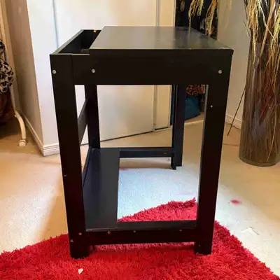 Black and laminated in color Fully assembled Easily accessible to mount up lighting Small nook to ho...