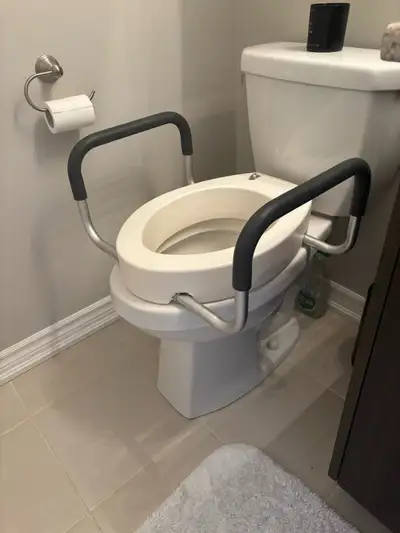 This brand new raised toilet seat with arms is designed to assist individuals who need extra help si...