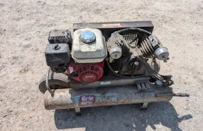 Gas powered air compressor, holds air and runs.
