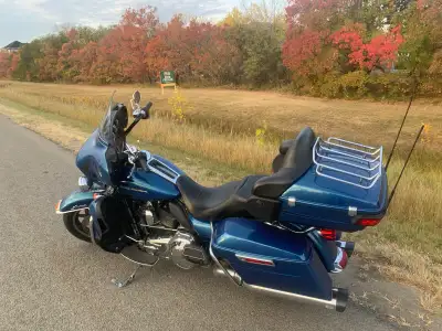 2014 Ultra limited Low metallic blue in great condition, Bike very much stock except the pipes Vance...