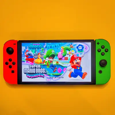 I'm selling this Nintendo Switch with Pink/Green joy con, case, dock and charger. Games are extra. I...