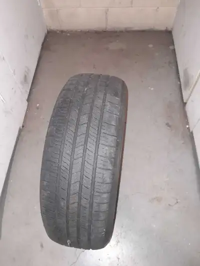 Michelin Defender XT tire. Size 215/65R15. Tubeless M+S. Suitable for all-season use. $10 each or $1...