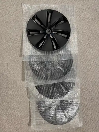 Set of 4 brand new OEM wheel covers (Tesla hub caps), never used Came with the Tesla winter tire pac...