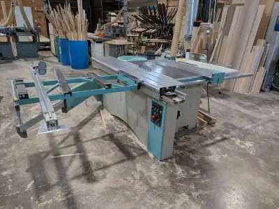 Silver 6' sliding table saw. 600v 7.5hp. Electronic up and down on the blade. We run a 14" blade in...