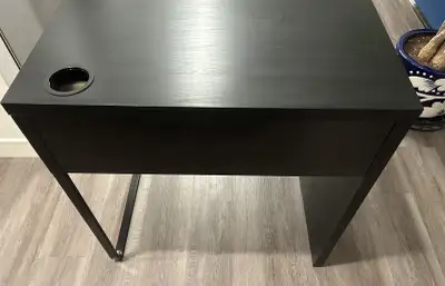 Sturdy black/Brown desk assembled withi a cable management hole. Measurements are: 73 x 50 cm 28 3/4...