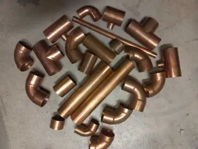 Assortment of copper plumbing couplings ,tees,nipples1-1/2"., View more