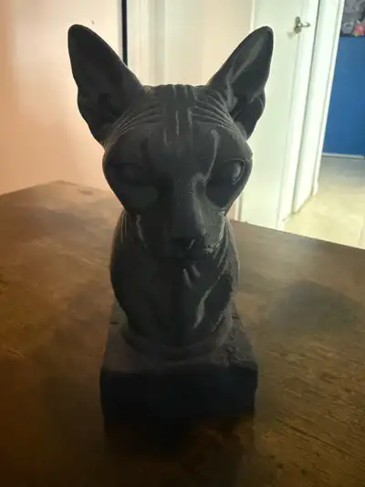 This is a used statue of a sphynx cat in good condition. 3-D printed very light and about 7 inches t...