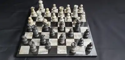 Marble chess board approximately 30 years old as 2 pieces ( king) missing cross on top and 1 pawn ne...