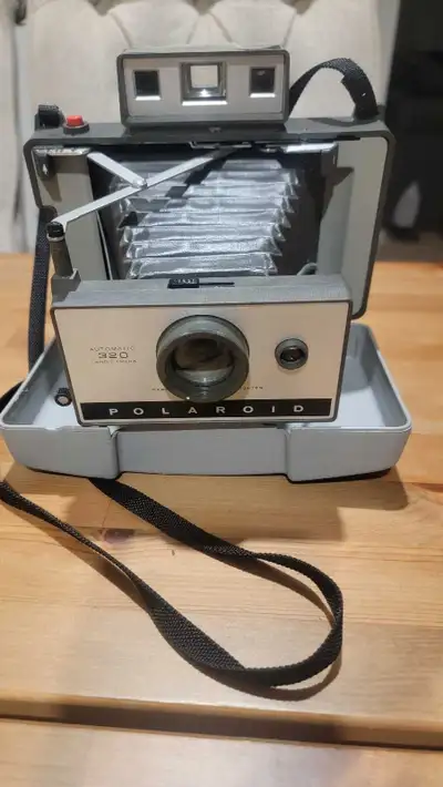 Vintage Polaroid camera 320 Pet and smoke free, in pretty good shape physically for its age. Would m...