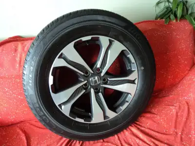 I am selling Honda CR-V four new 235/65R17 Bridgestone (Ecopia H/L 422) all season tires on NEW Hond...