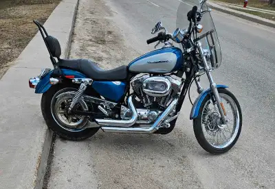 Saftied 2005 harley davidson 1200xl sportster for sale. Saftued until June 2025. Vance and Hines dou...