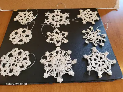 9 different crochet snowflakes Christmas Tree Ornaments. Just like in real life, no two snowflakes a...