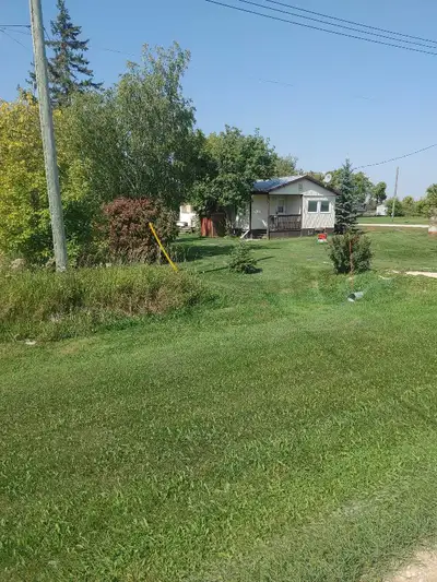 2 bedroom/ 1 sunroom double wide trailor with metal roof and nice shed. This lot is semi private cor...
