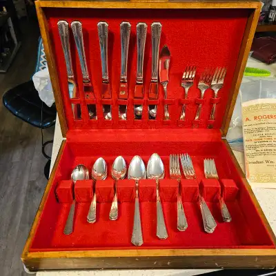 This is a WMA Roger's Triple Oneida flatware set, complete with its original wooden box and paperwor...