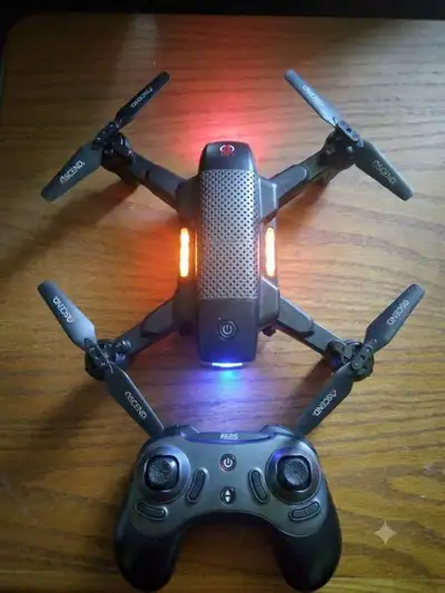 Compact black Ascend drone. Drone has foldable arms and working lights. Comes with matching controll...