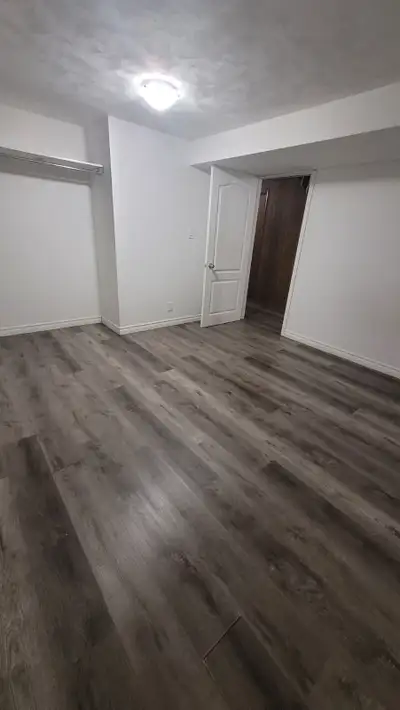 Two private bedrooms are available for rent in a basement.