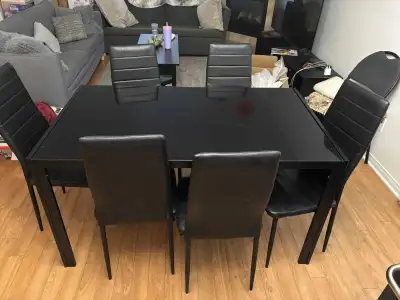 This is a used IKEA dining table set, perfect for any modern dining room. The set includes a sleek,...