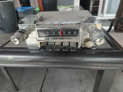 This is a vintage Ford Mercury car radio. It is in used condition, with some signs of wear consisten...