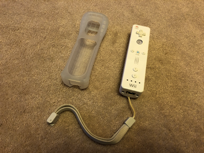 Official Wii remote. White Fully tested. Comes with wrist strap and silicone sleeve. $20 Third-party...