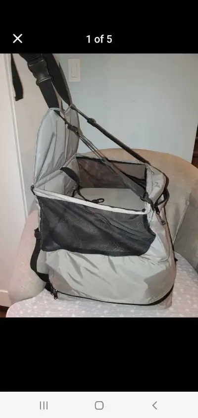 Booster seat for small dogs/cats to look out window, has safety leash, is grey, straps into any car...