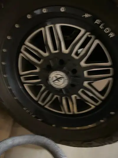 Upgrade your ride with this set of four used Flow Off-Road wheels and rugged tires, designed for sup...