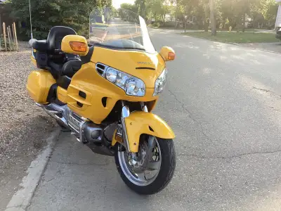 Offering for sale 2001 Honda Goldwing. Always stored inside. Highly visible metallic yellow. Service...