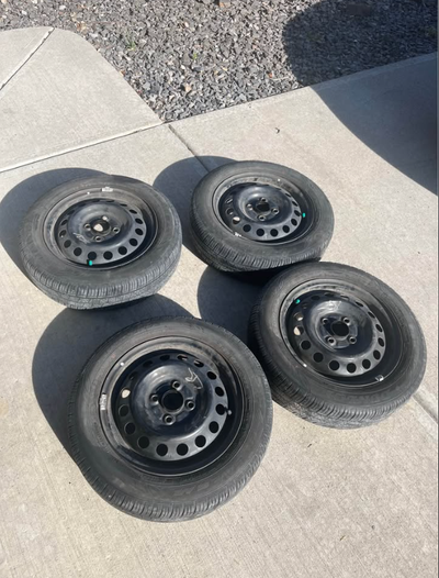 I have 4 matching 14 inch 4x100 rims on matching Dunlop 165/55R14 ALL SEASON M+S tires. Tires are in...