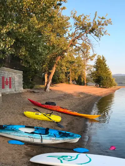 Cabin for sale on beautiful Fraser Lake. -1.22 acres with 180 ft of sandy beachfront -32’x36’ shop w...