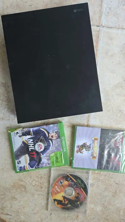 Xbox one X 1TB with games and 2 controllers, View more