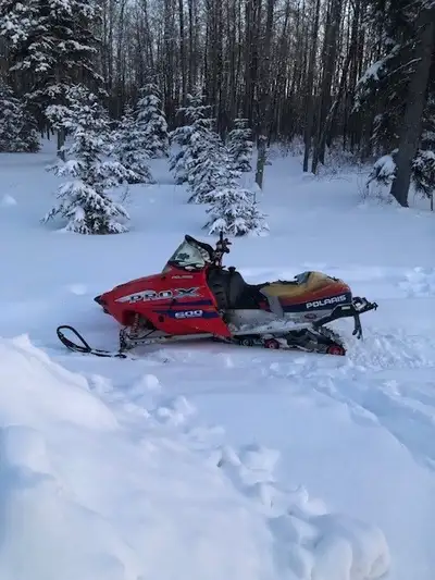 Polaris 600 Pro-X Snowmobile. Liquid cooled and reverse. Everything works great except seat cover is...