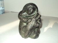 A WOLF ORIGINAL SCULPTURE - INUIT HOLDING A SEAL - RARE