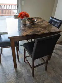 Bar height table and chairs