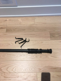 Black metal curtain rod with hardware