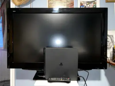 PlayStation 4, large Panasonic TV, Two Controllers and games, View more