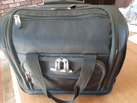 Carry-on Luggage with wheels, never been used NEW condition