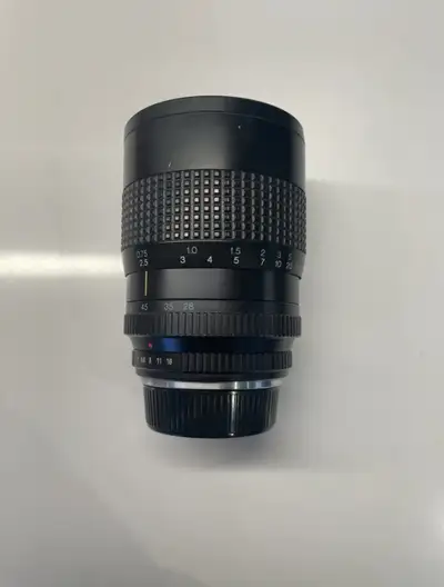 Vintage Tokina RMC 28-85mm zoom lens for sale. Shows some wear. Manual focus. Great for film cameras...