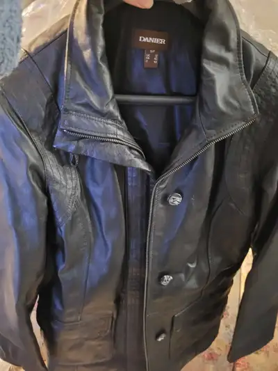Danier, ladies size Small, black leather jacket with detachable hood and collar. Never been worn! (C...