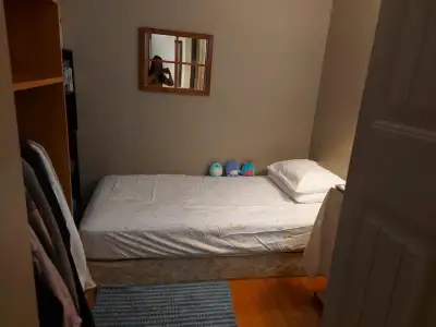 Furnished private & quiet cozy room/den in shared 3 bedroom hirise with 2 roommates a few steps away...