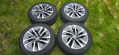 17 inch OEM Honda mags with continental Viking contact 7 winter tires. Mags have some curb rash (scr...