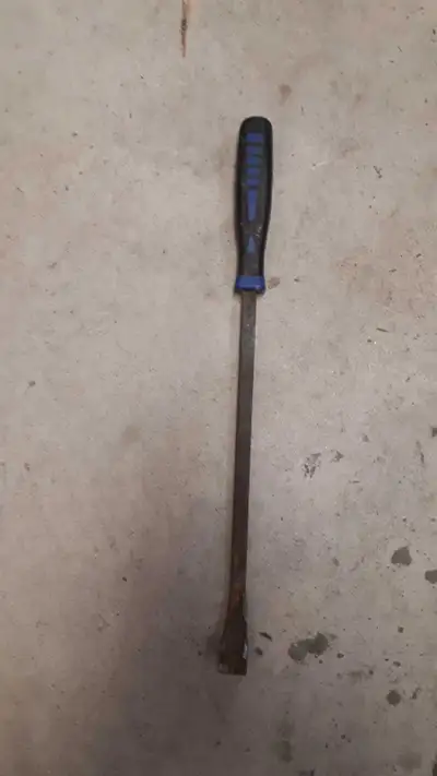 I am selling a used pry bar, a sturdy tool perfect for various leverage tasks. It shows signs of wea...