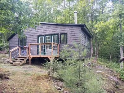 450' waterfront 4.5 acres 10 minute boat ride 2 minutes to snowmobile trails. Renovated inside and o...