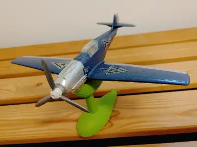 Miniature airplane with wind-up moving propeller, View more