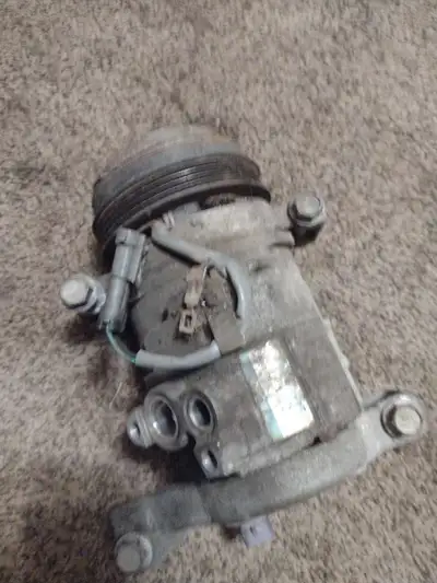 This is a working AC pump from a 2007 Chevy Express, perfect for restoring your van's cooling system...