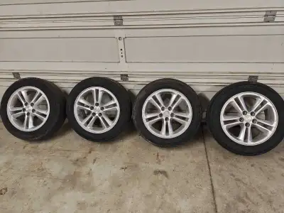 Gen 2 cruze wheels 205/55r16 One tire has been plugged clean rims put away with 32psi in each wheel...