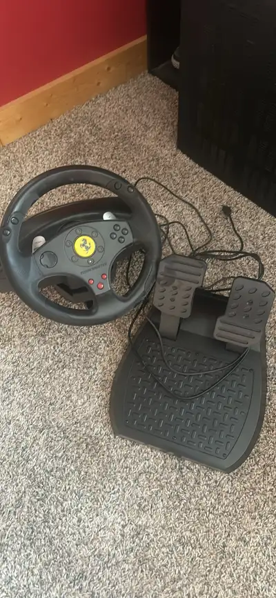Ferrari thrust master gaming wheel and pedals $60, View more