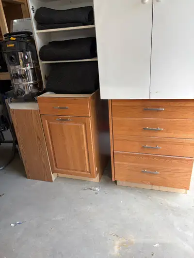 Upgrade your kitchen cottage or your garage space with this set of sturdy, pre-owned kitchen cabinet...