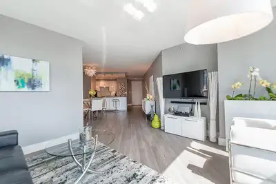 Discover effortless living in a private twin-size bedroom with a shared modern bathroom, access to a...